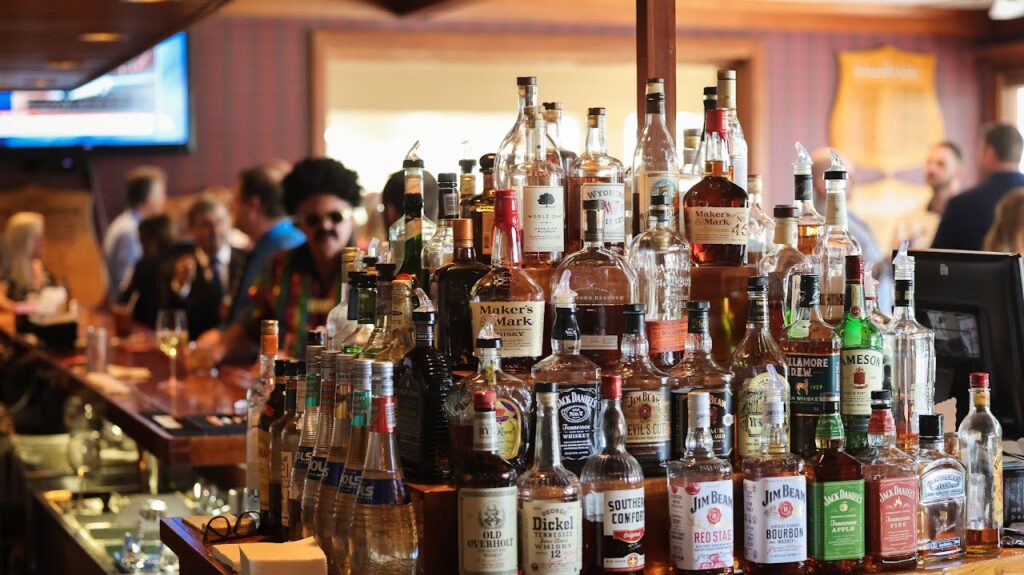 bar with a pyramid of alcohol bottles artfully arranged